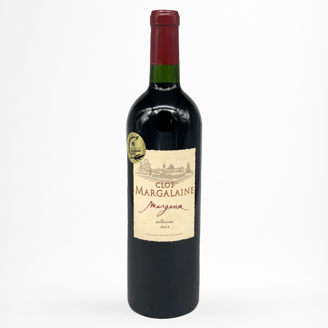 Bouteille de vin rouge Clos Margalaine 2013 Margaux, étiquette crème avec château, capsule rouge