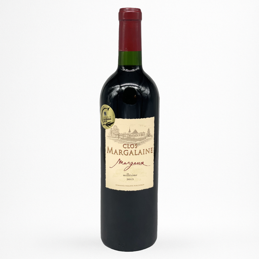 Bouteille de vin rouge Clos Margalaine 2013 Margaux, étiquette crème avec château, capsule rouge