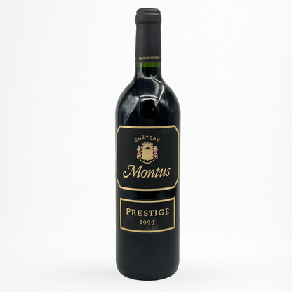 Bouteille de vin rouge Château Montus Prestige 1999 Madiran, étiquette noire bord doré, capsule noire, fond blanc