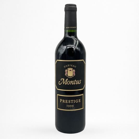 Bouteille de vin rouge Château Montus Prestige 1999 Madiran, étiquette noire bord doré, capsule noire, fond blanc